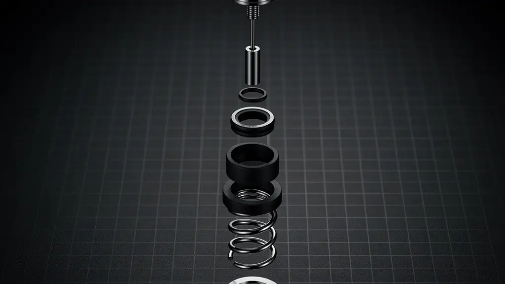 Vue en coupe technique d'un poussoir de chronographe montrant les joints toriques et le mécanisme interne